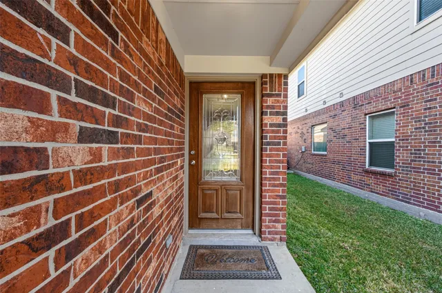a view of a door with a door and wooden floor