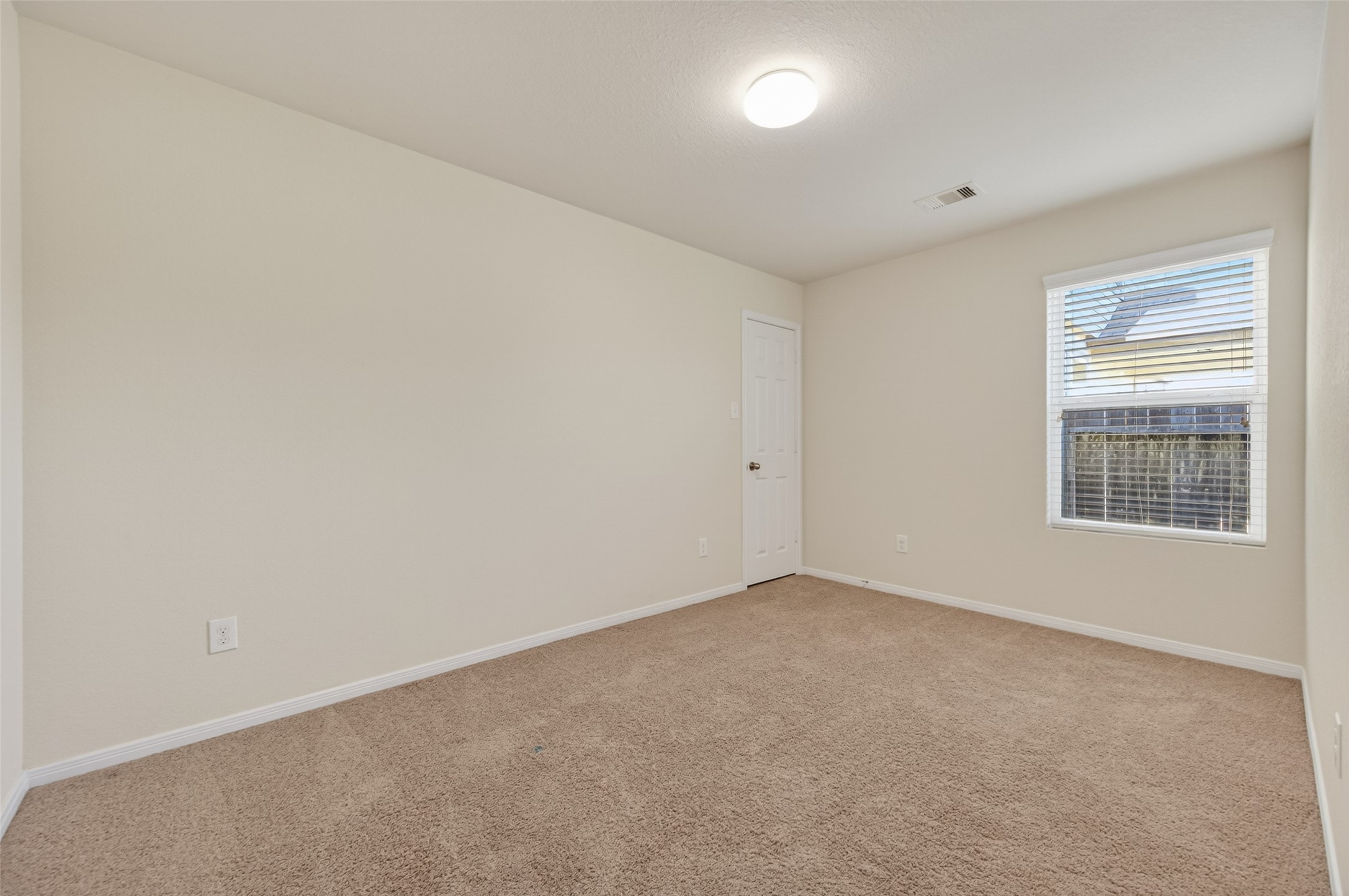 2487 Elm Crossing Trail Spring, TX 77386 - Photo 32 of 46 a view of an empty room with a window