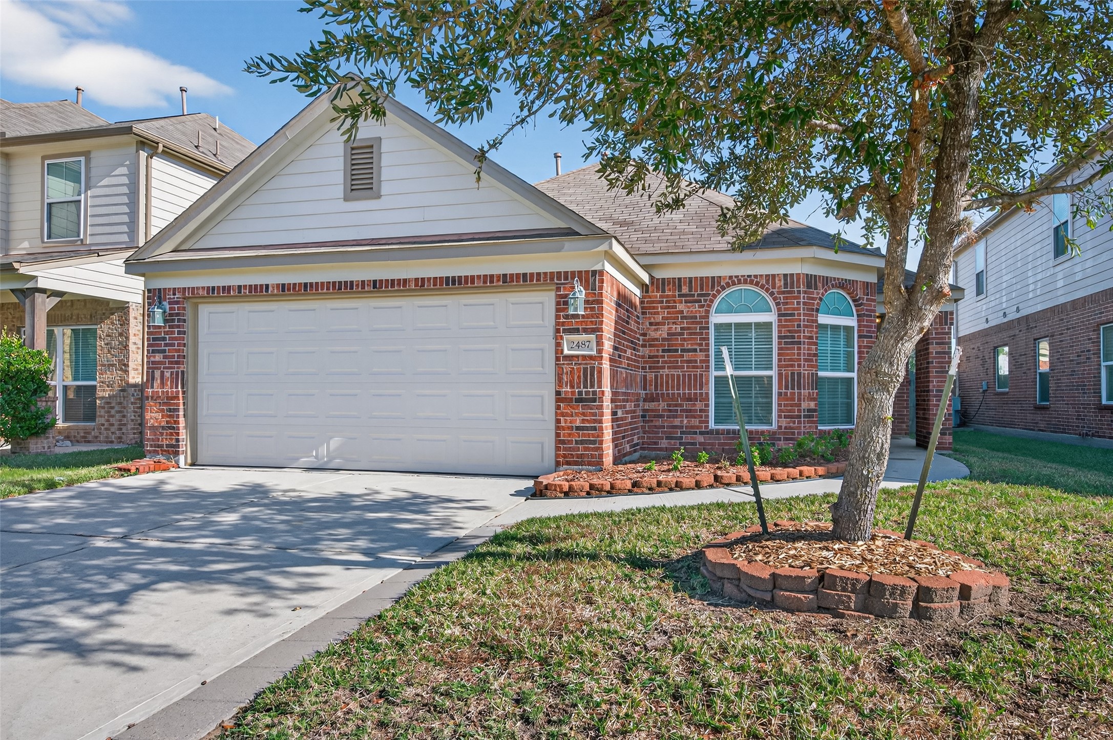 2487 Elm Crossing Trail Spring, TX 77386 - Photo 46 of 46 a front view of a house with a yard and garage