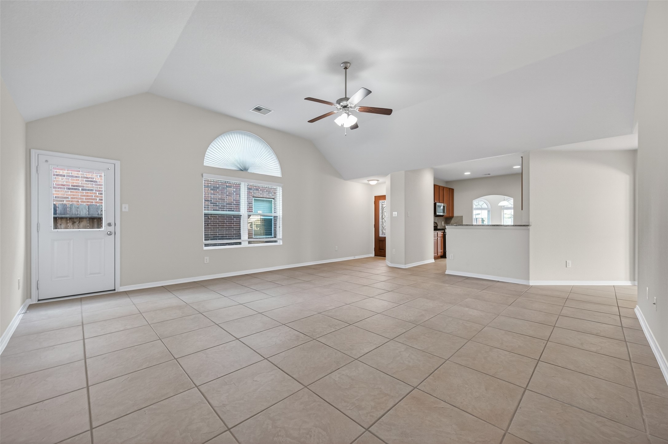 2487 Elm Crossing Trail Spring, TX 77386 - Photo 7 of 46 a view of an empty room with a window