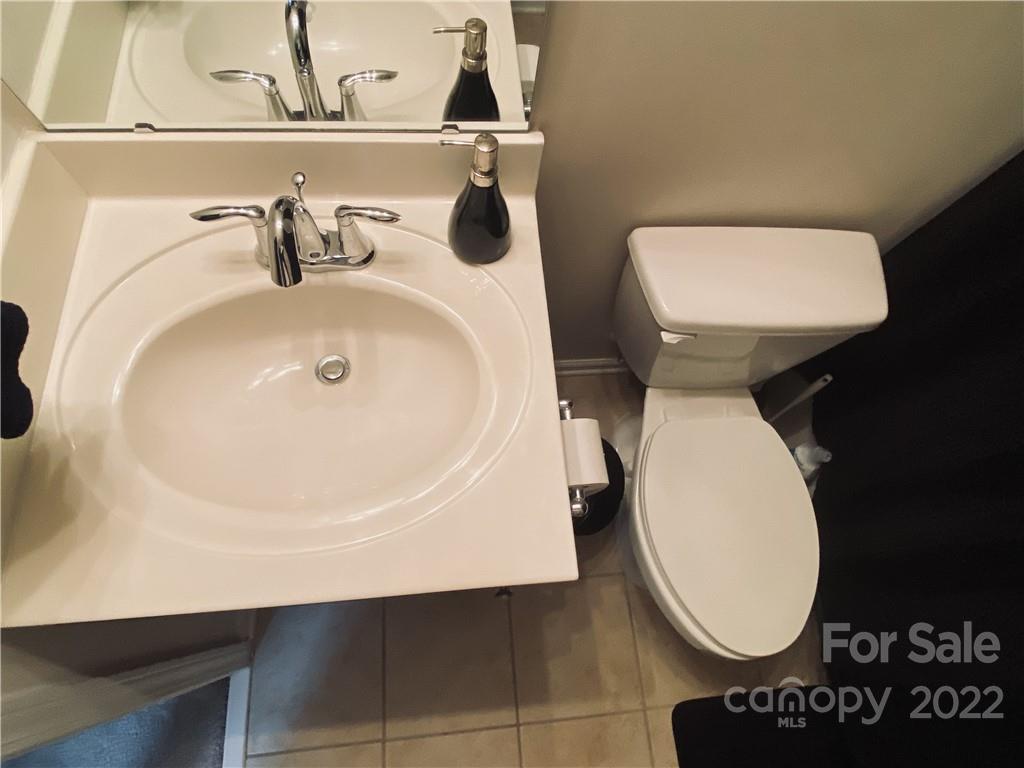 5604 Whitehawk Hill Road Mint Hill, NC 28227 - Photo 16 of 18 a bathroom with a toilet and a sink