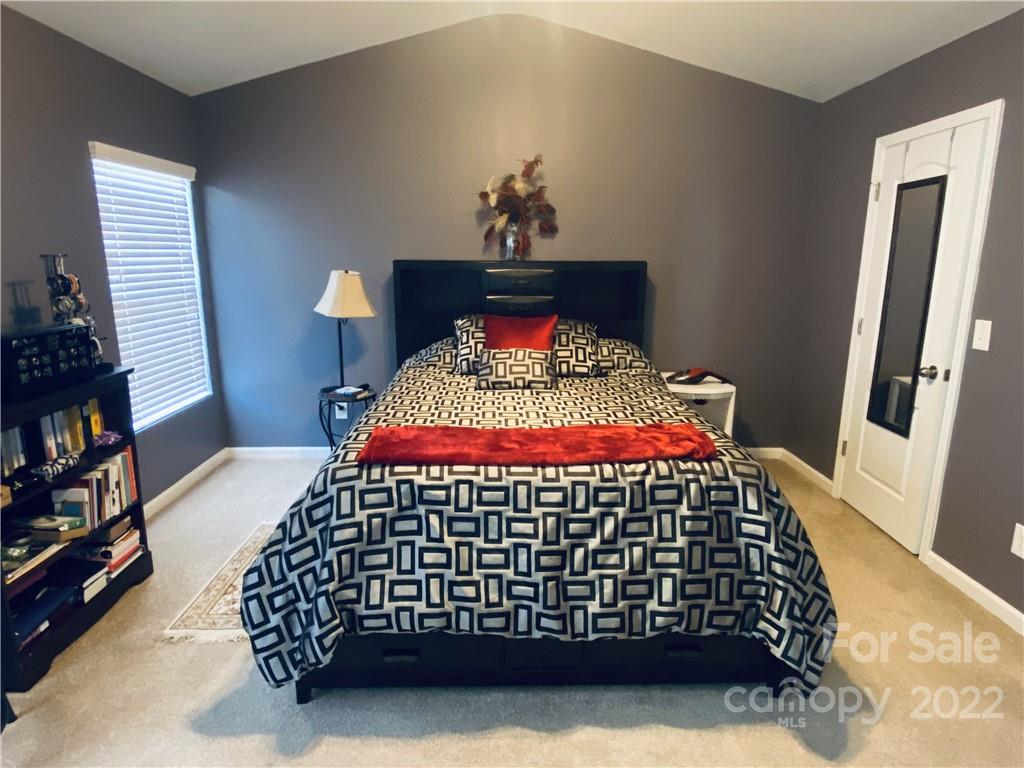5604 Whitehawk Hill Road Mint Hill, NC 28227 - Photo 7 of 18 a bedroom with a bed and a window