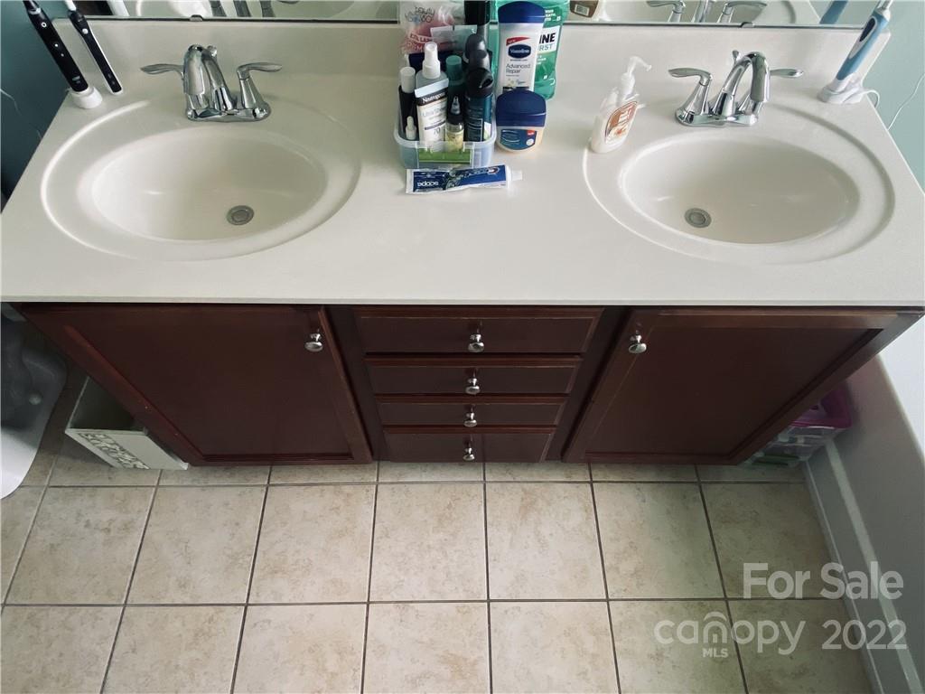 5604 Whitehawk Hill Road Mint Hill, NC 28227 - Photo 10 of 18 a bathroom with a sink and a mirror
