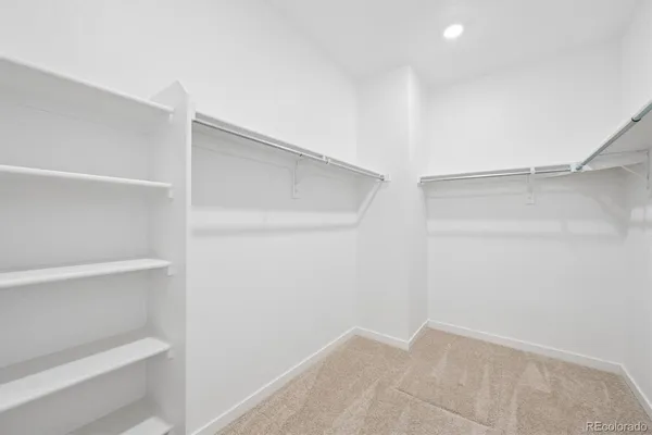 a view of an empty walk in closet