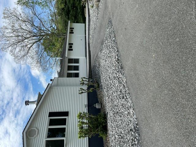 100 Decker Road, Unit 2 Wallkill, NY 12589 - Photo 6 of 23 a front view of a house with garden