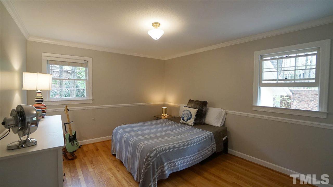 809 Tinkerbell Road Chapel Hill, NC 27517 - Photo 11 of 19 a bedroom with a bed and a window