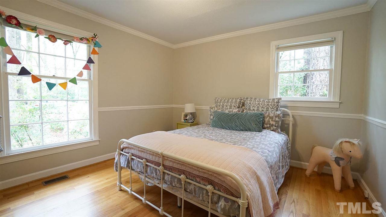 809 Tinkerbell Road Chapel Hill, NC 27517 - Photo 12 of 19 a bedroom with a bed and a window