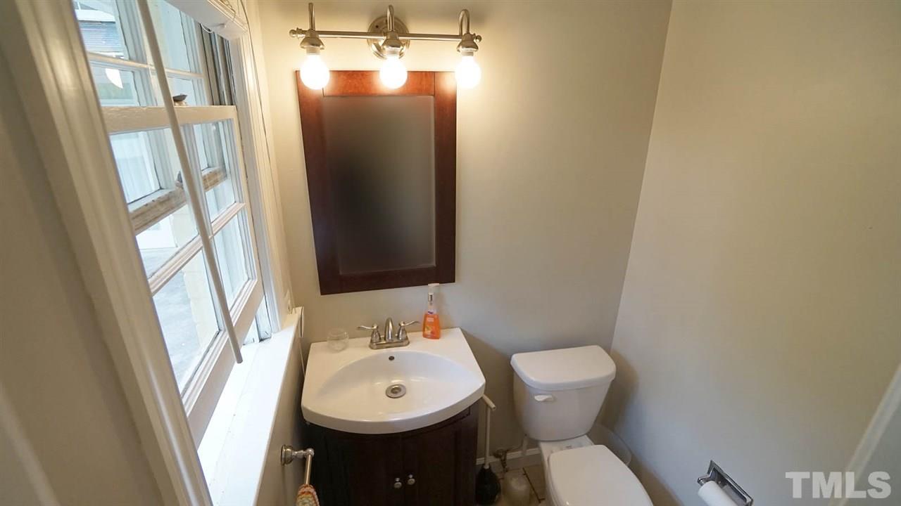 809 Tinkerbell Road Chapel Hill, NC 27517 - Photo 13 of 19 a bathroom with a sink and mirror with toilet
