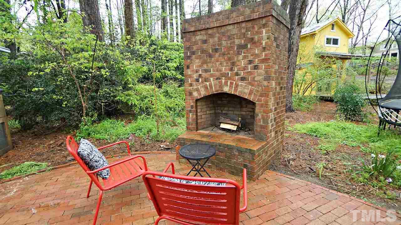 809 Tinkerbell Road Chapel Hill, NC 27517 - Photo 14 of 19 a backyard of a house with table and chairs