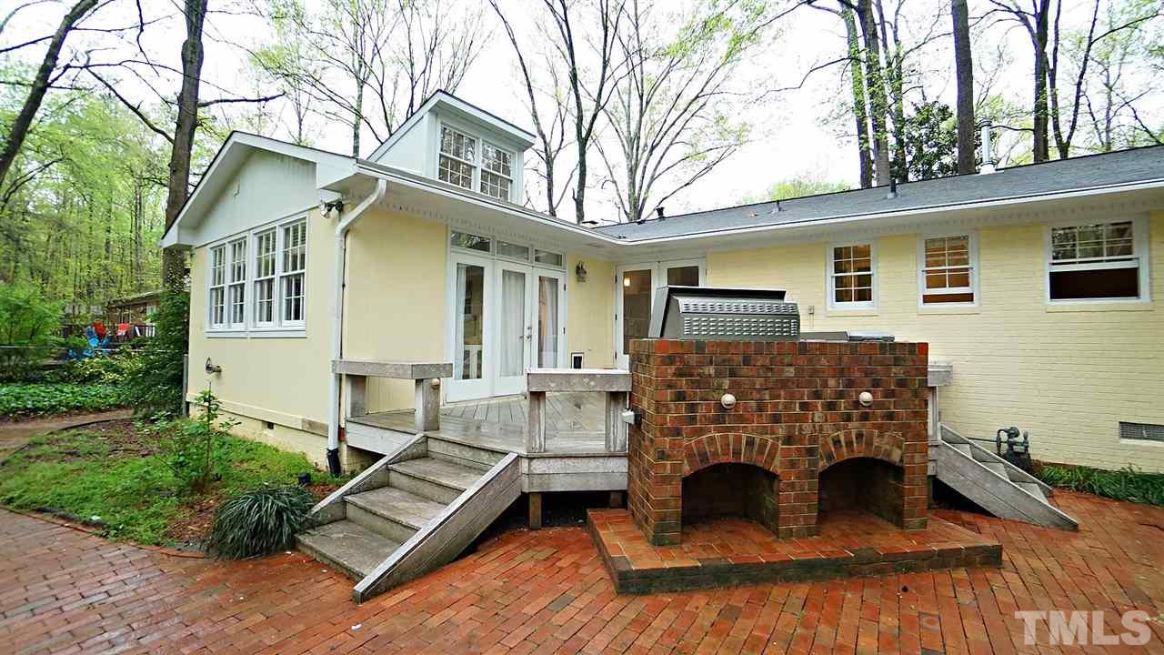 809 Tinkerbell Road Chapel Hill, NC 27517 - Photo 15 of 19 a view of a house with a yard and sitting area
