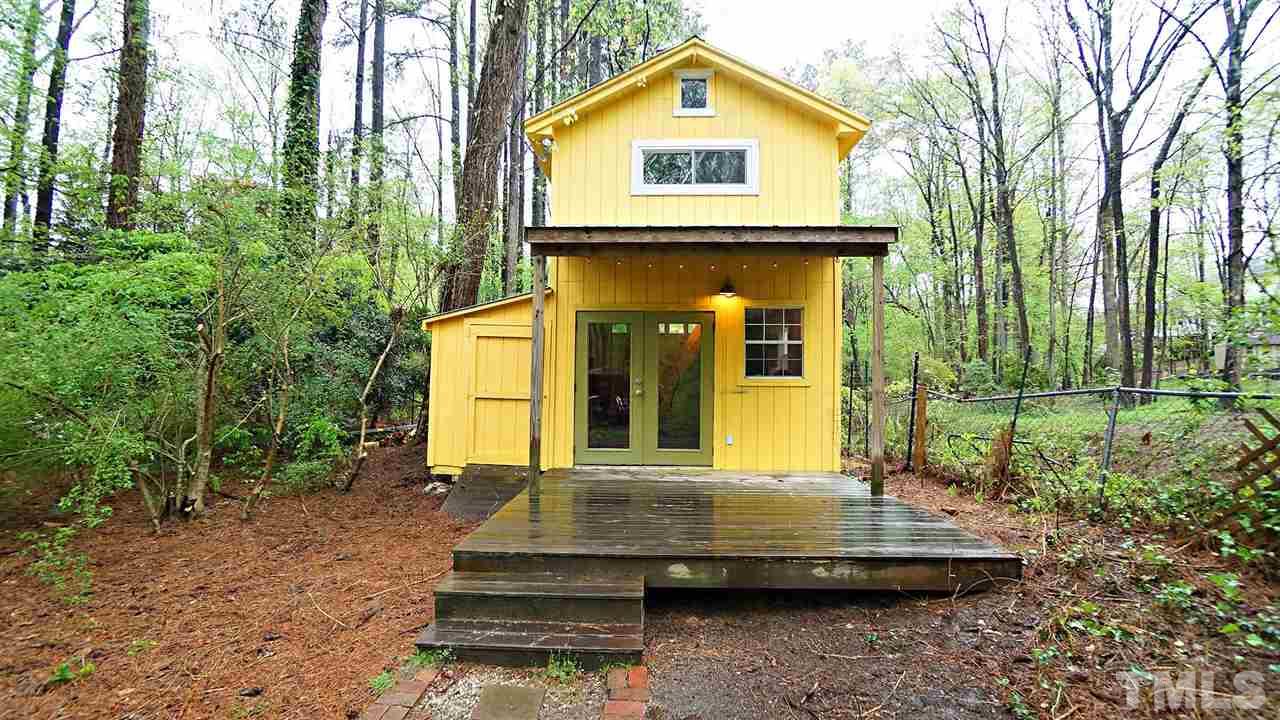 809 Tinkerbell Road Chapel Hill, NC 27517 - Photo 16 of 19 a front view of a house with a yard