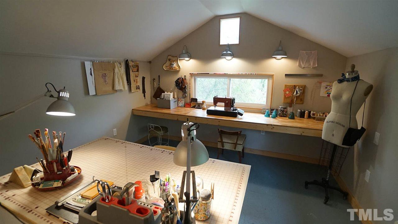 809 Tinkerbell Road Chapel Hill, NC 27517 - Photo 19 of 19 a kitchen with a sink appliances and cabinets