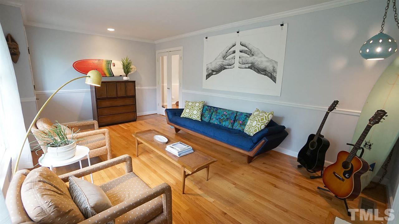 809 Tinkerbell Road Chapel Hill, NC 27517 - Photo 3 of 19 a living room with furniture and wooden floor