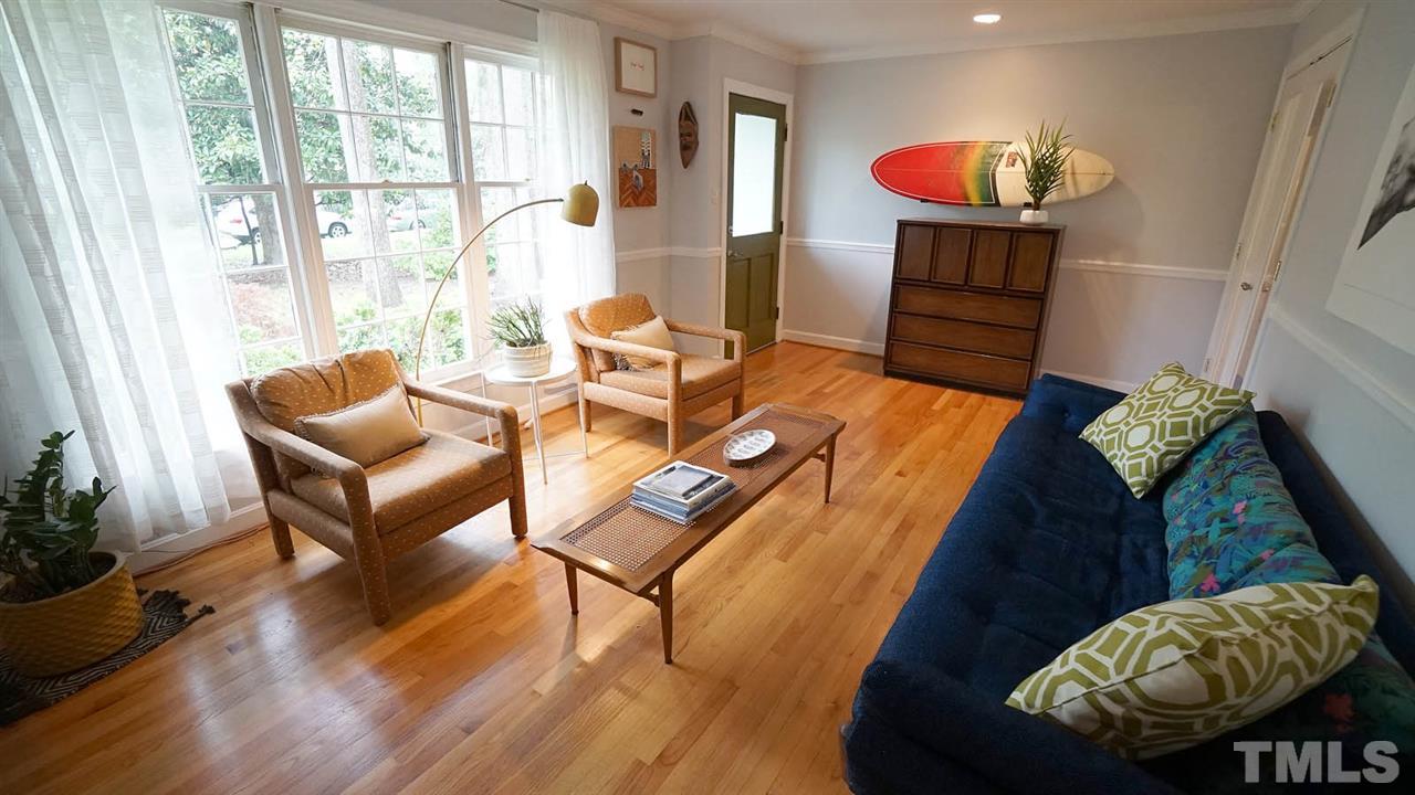 809 Tinkerbell Road Chapel Hill, NC 27517 - Photo 4 of 19 a living room with furniture and a wooden floor