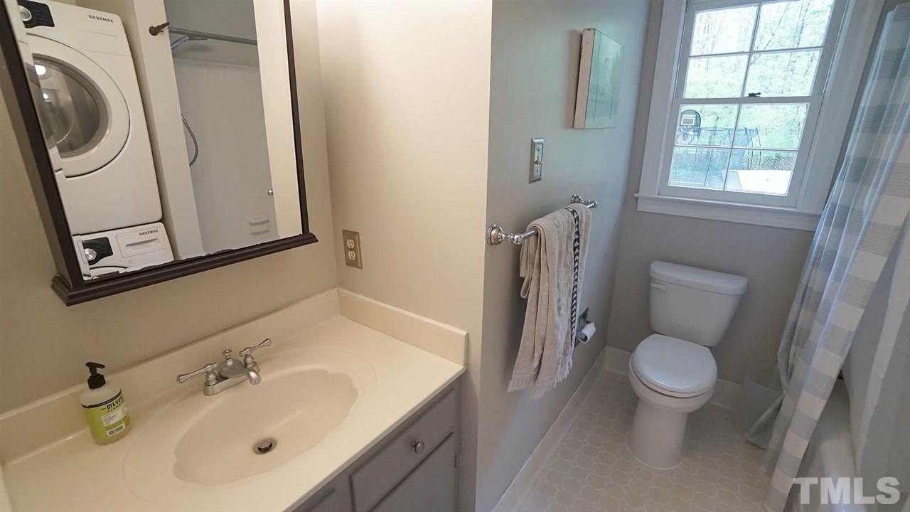 809 Tinkerbell Road Chapel Hill, NC 27517 - Photo 9 of 19 a bathroom with a sink a toilet and a mirror
