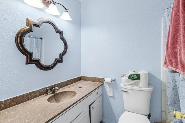 a bathroom with a sink and a toilet