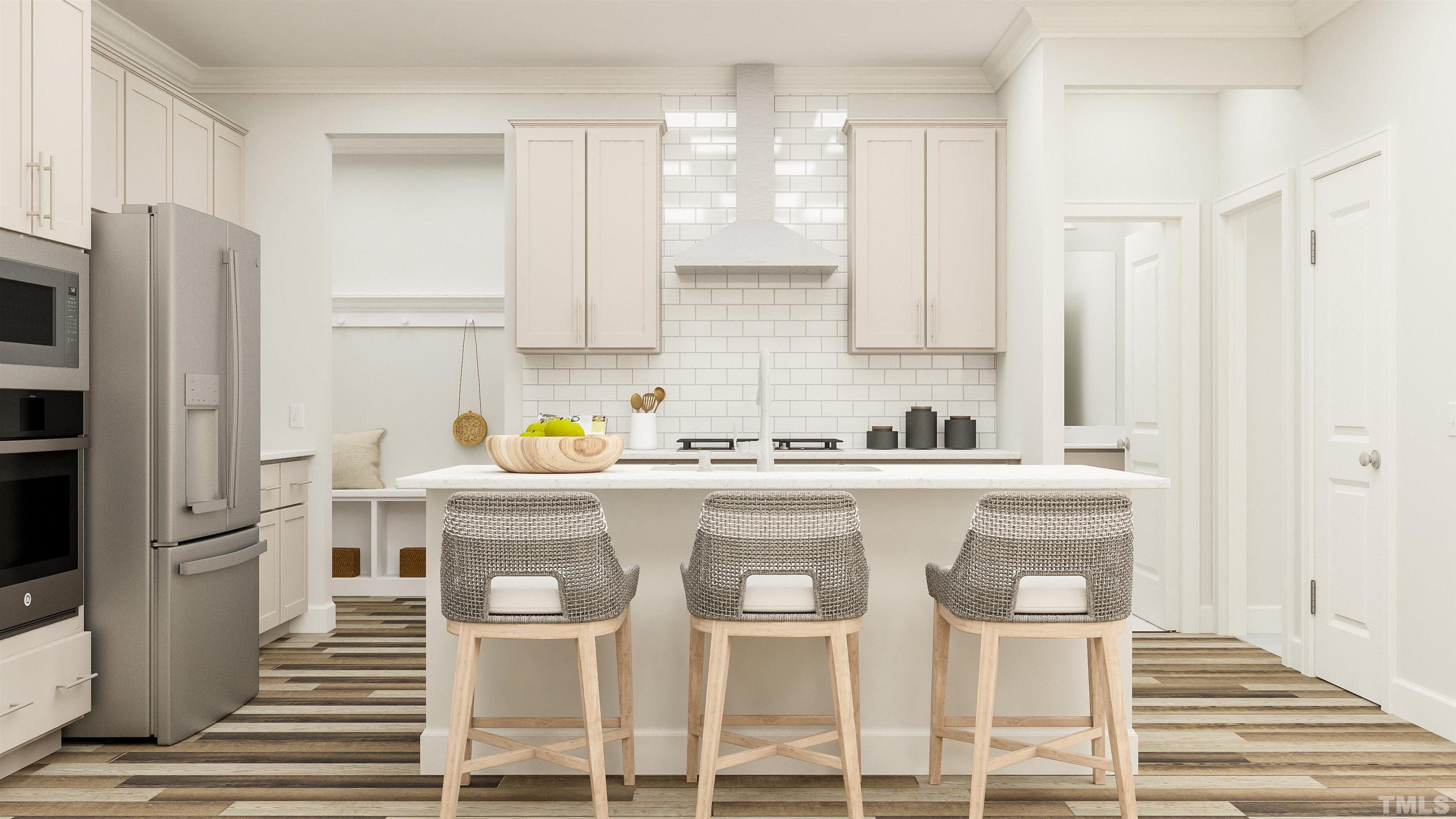 To Be Added, Unit 434 Apex, NC 27502 - Photo 2 of 9 a white kitchen with wooden floor and stainless steel appliances