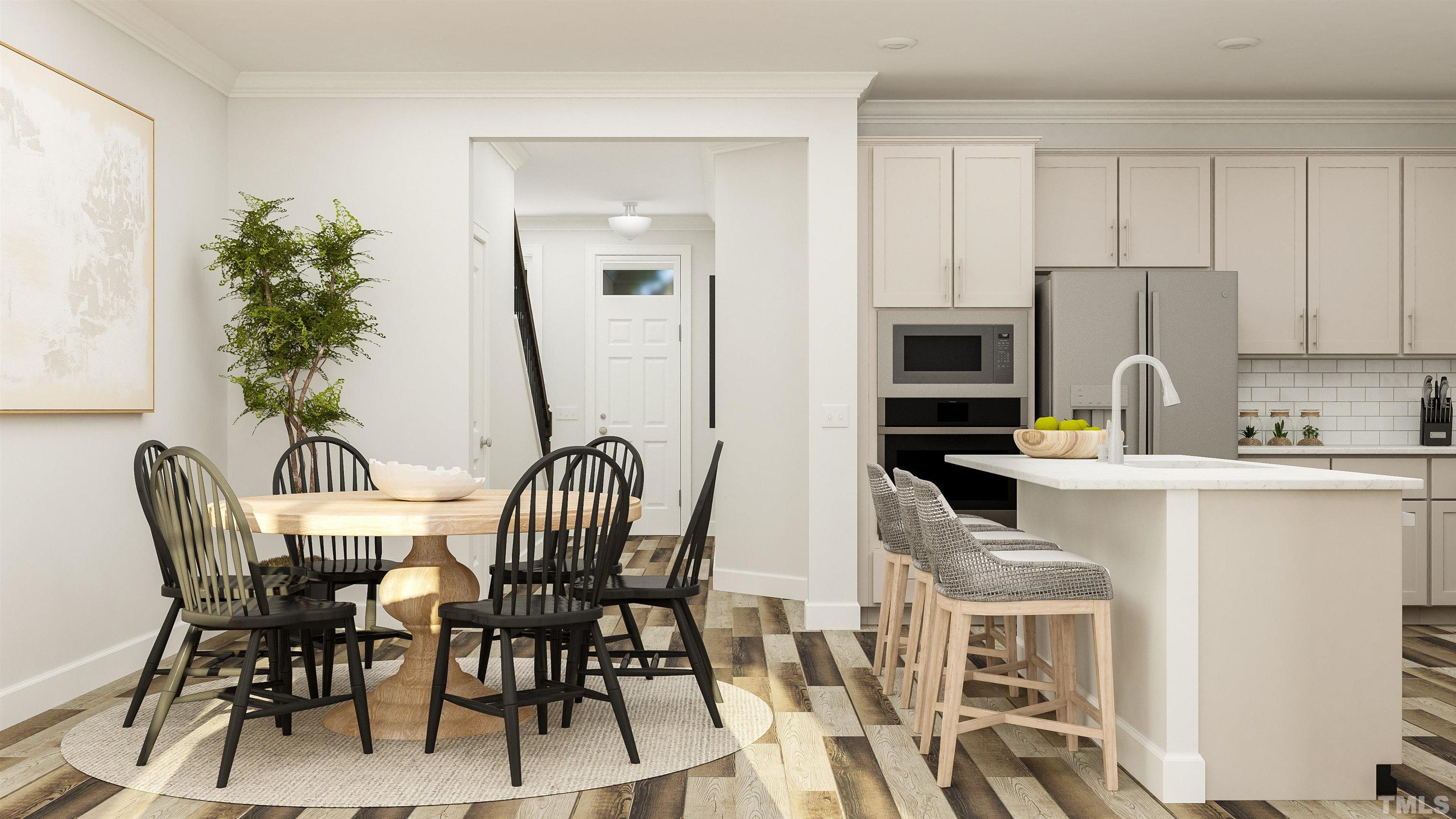 To Be Added, Unit 434 Apex, NC 27502 - Photo 3 of 9 a view of a dining room with furniture and a kitchen