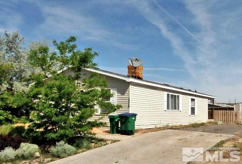 1379 Leopard Street Reno, NV 89506 - Photo 1 of 1 a side view of a house with a yard