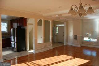 2904 Allendale Road Baltimore, MD 21216 - Photo 5 of 30 a view of a hallway with wooden floor and staircase