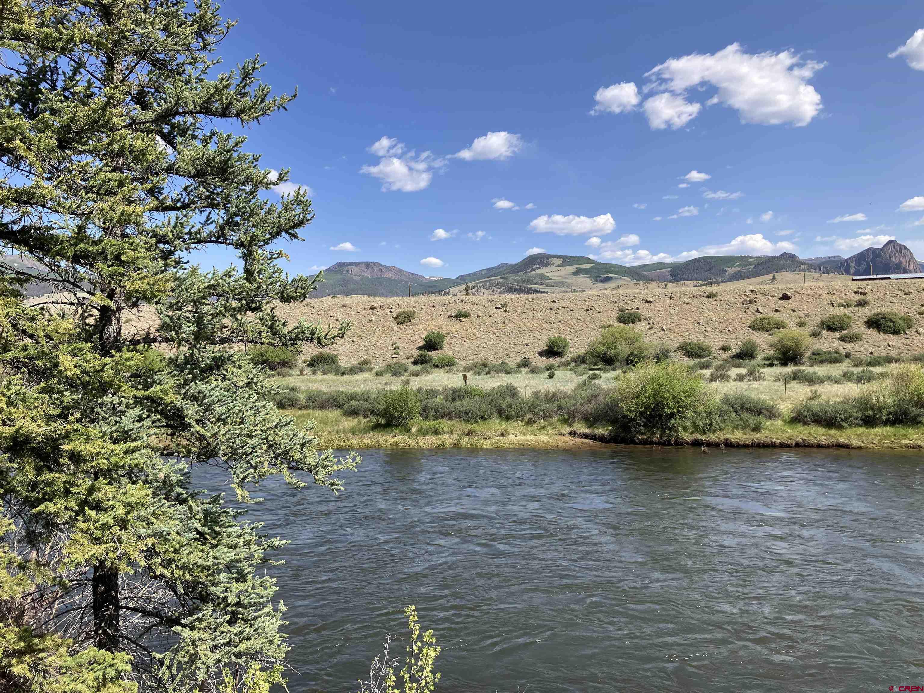 442 Deep Creek Road Creede, CO 81130 - Photo 18 of 45 a view of a lake with a mountain