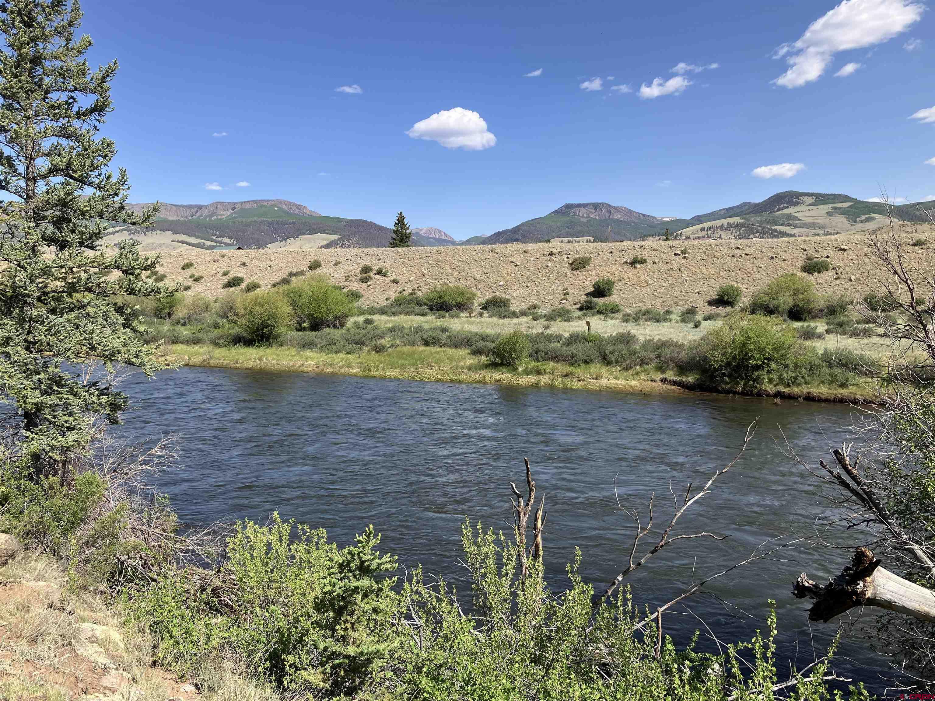 442 Deep Creek Road Creede, CO 81130 - Photo 28 of 45 a view of a lake with mountains in the background