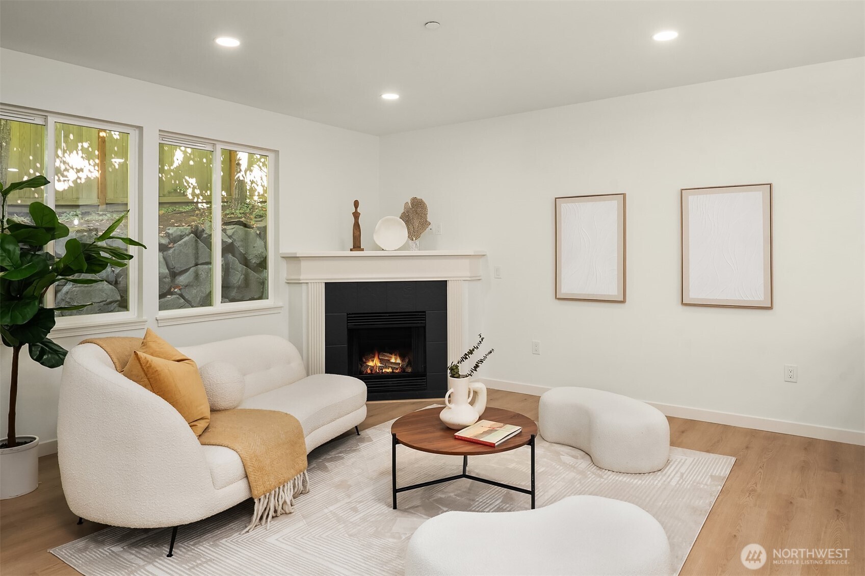 200 South 48th Street, Unit E Renton, WA 98055 - Photo 11 of 29 a living room with furniture and a fireplace