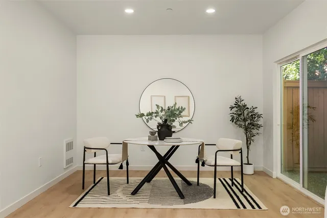 a view of a livingroom with furniture and wooden floor