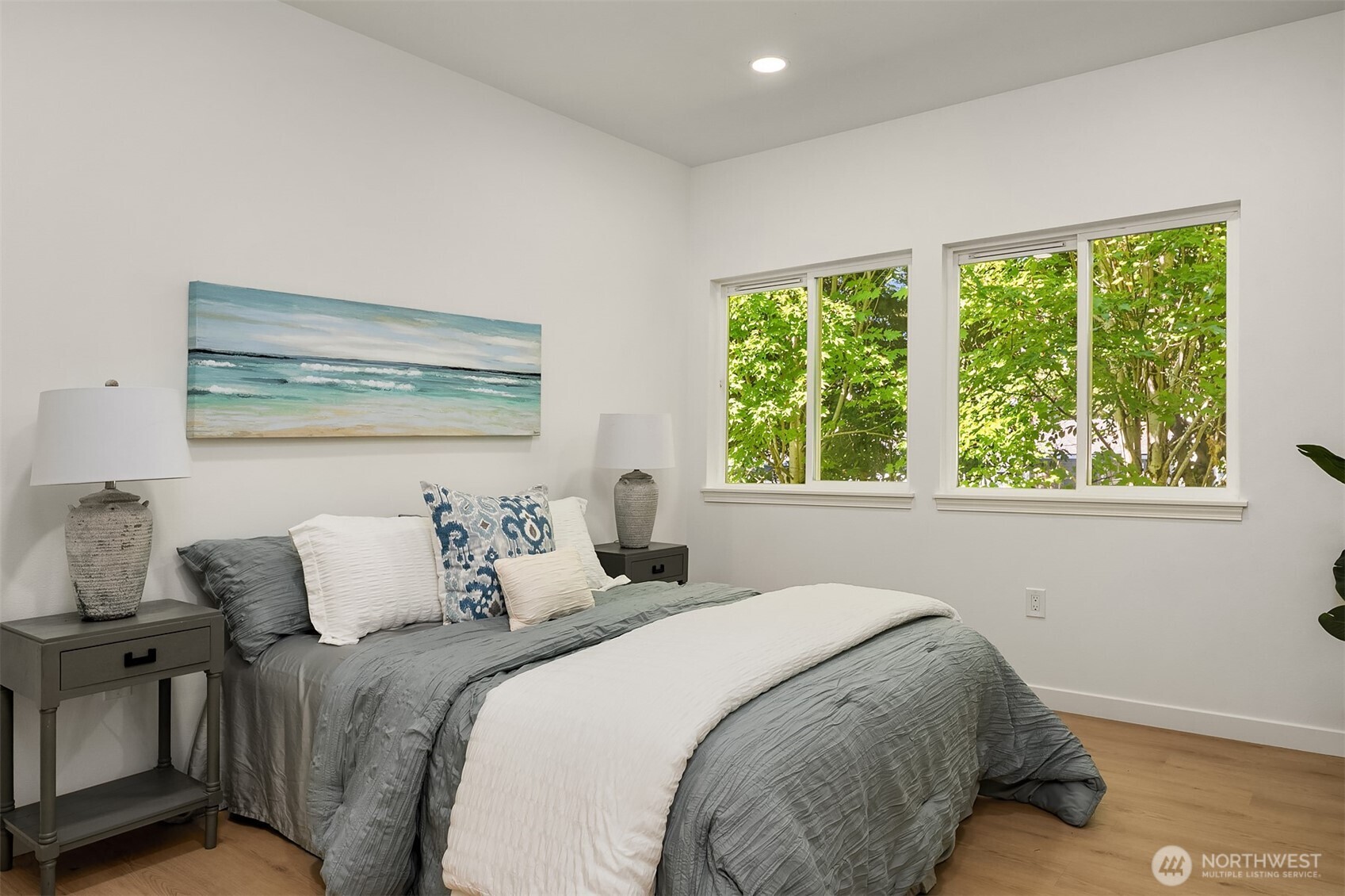 200 South 48th Street, Unit E Renton, WA 98055 - Photo 16 of 29 a bedroom with a bed and a window