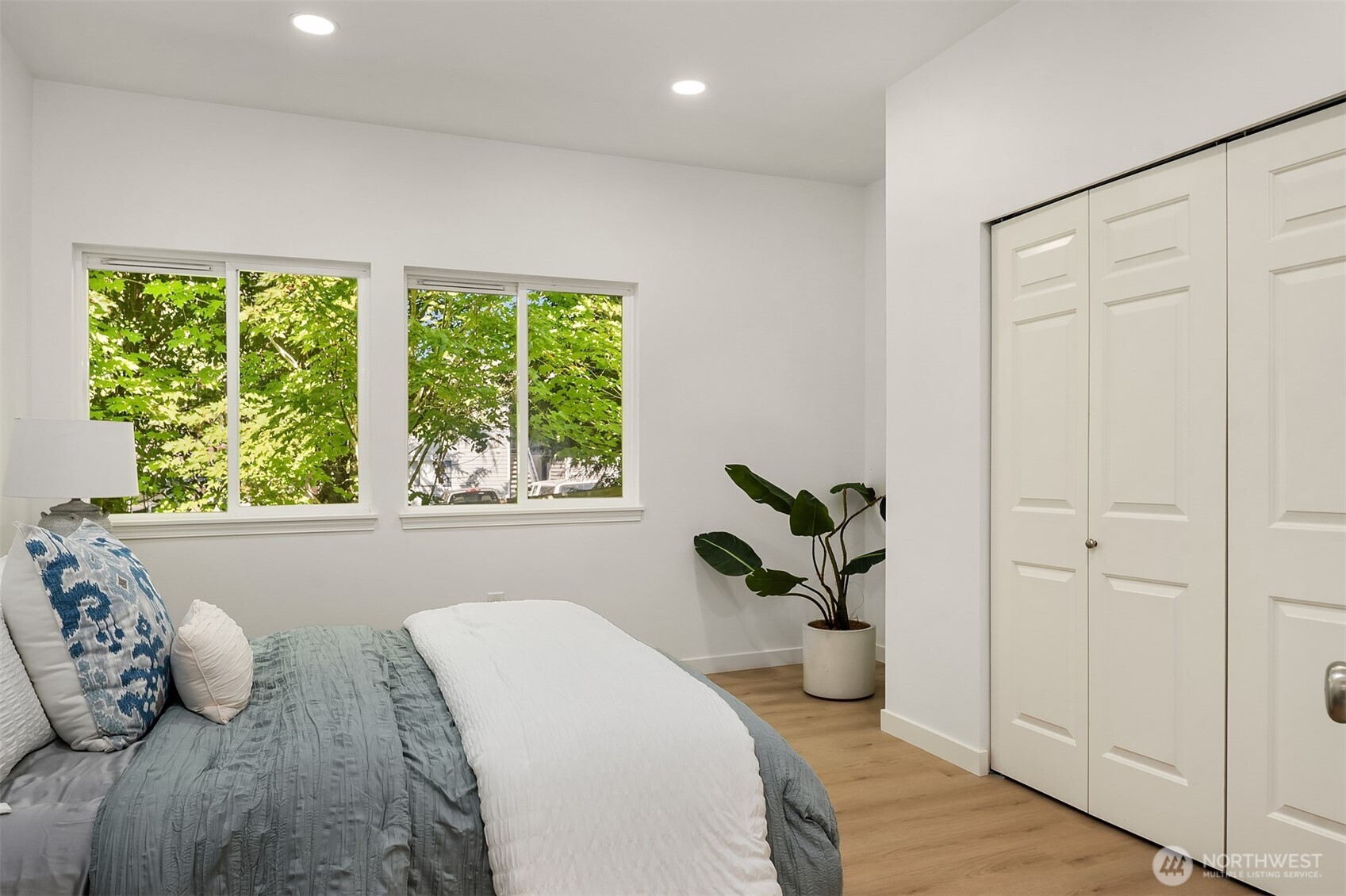 200 South 48th Street, Unit E Renton, WA 98055 - Photo 17 of 29 a dining room with furniture and a potted plant