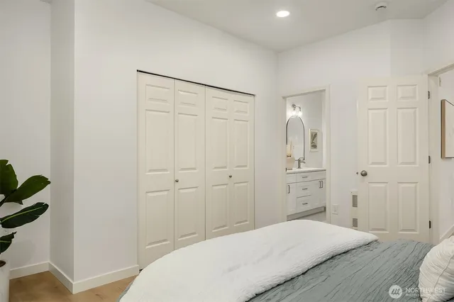 a bedroom with a bed and a hallway