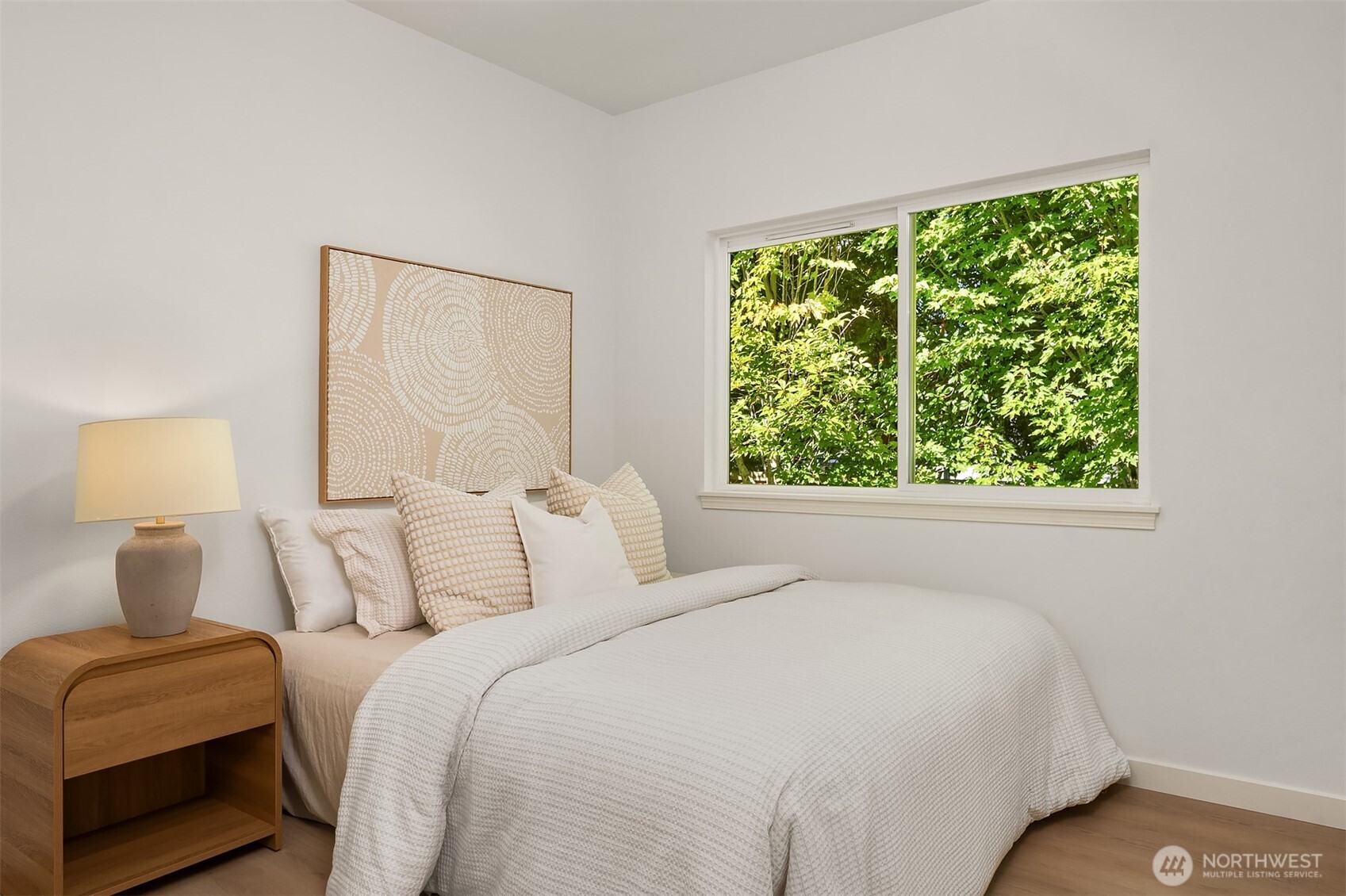 200 South 48th Street, Unit E Renton, WA 98055 - Photo 21 of 29 a bedroom with a bed and a window