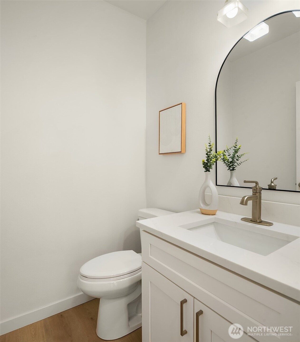 200 South 48th Street, Unit E Renton, WA 98055 - Photo 24 of 29 a bathroom with a toilet sink and mirror