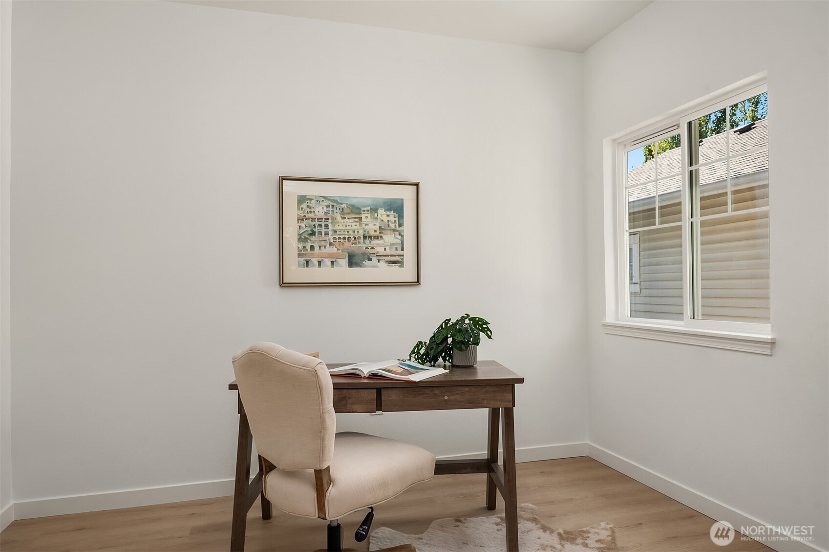 200 South 48th Street, Unit E Renton, WA 98055 - Photo 25 of 29 a view of a workspace with furniture and wooden floor