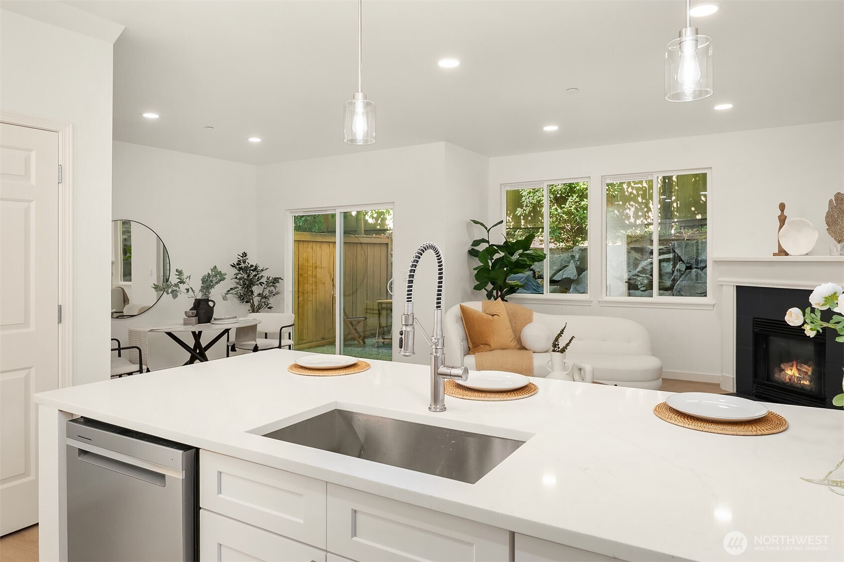 200 South 48th Street, Unit E Renton, WA 98055 - Photo 5 of 29 a kitchen with a sink and living room