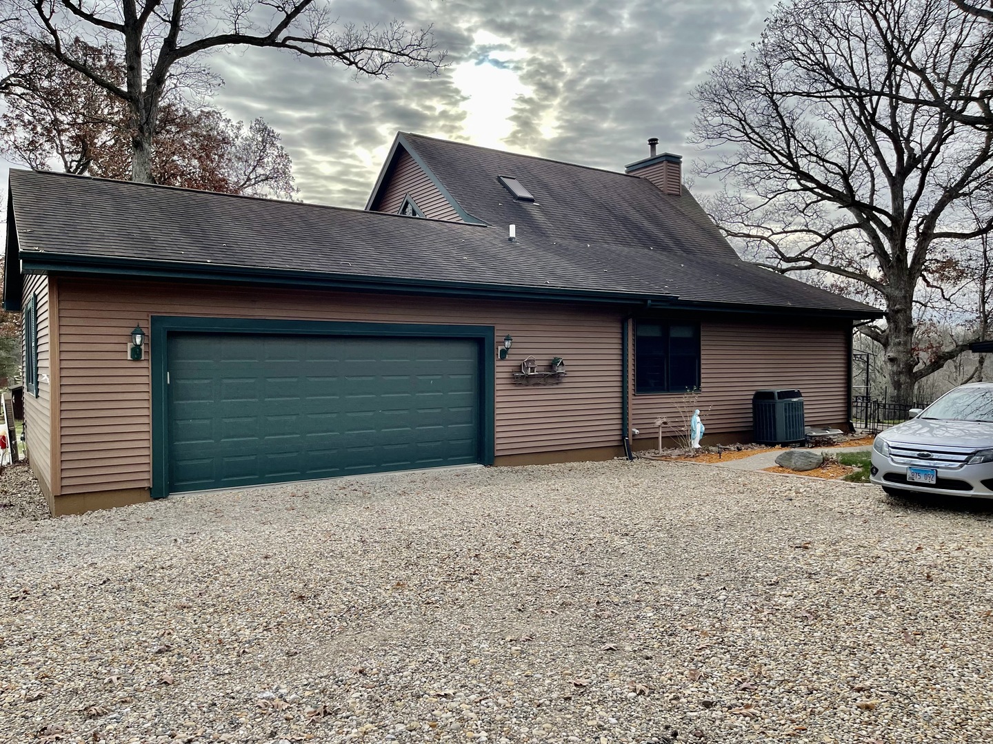 2121 East 875th Road Tonica, IL 61370 - Photo 5 of 17 a front view of a house with a yard and garage