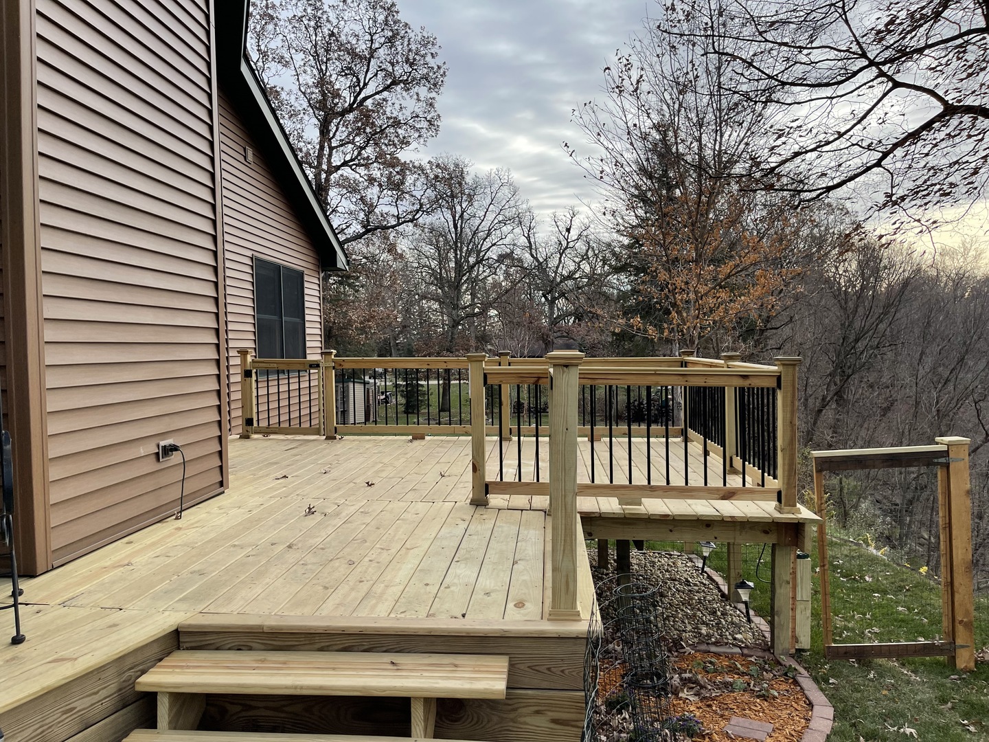 2121 East 875th Road Tonica, IL 61370 - Photo 7 of 17 a view of a house with wooden deck and a backyard