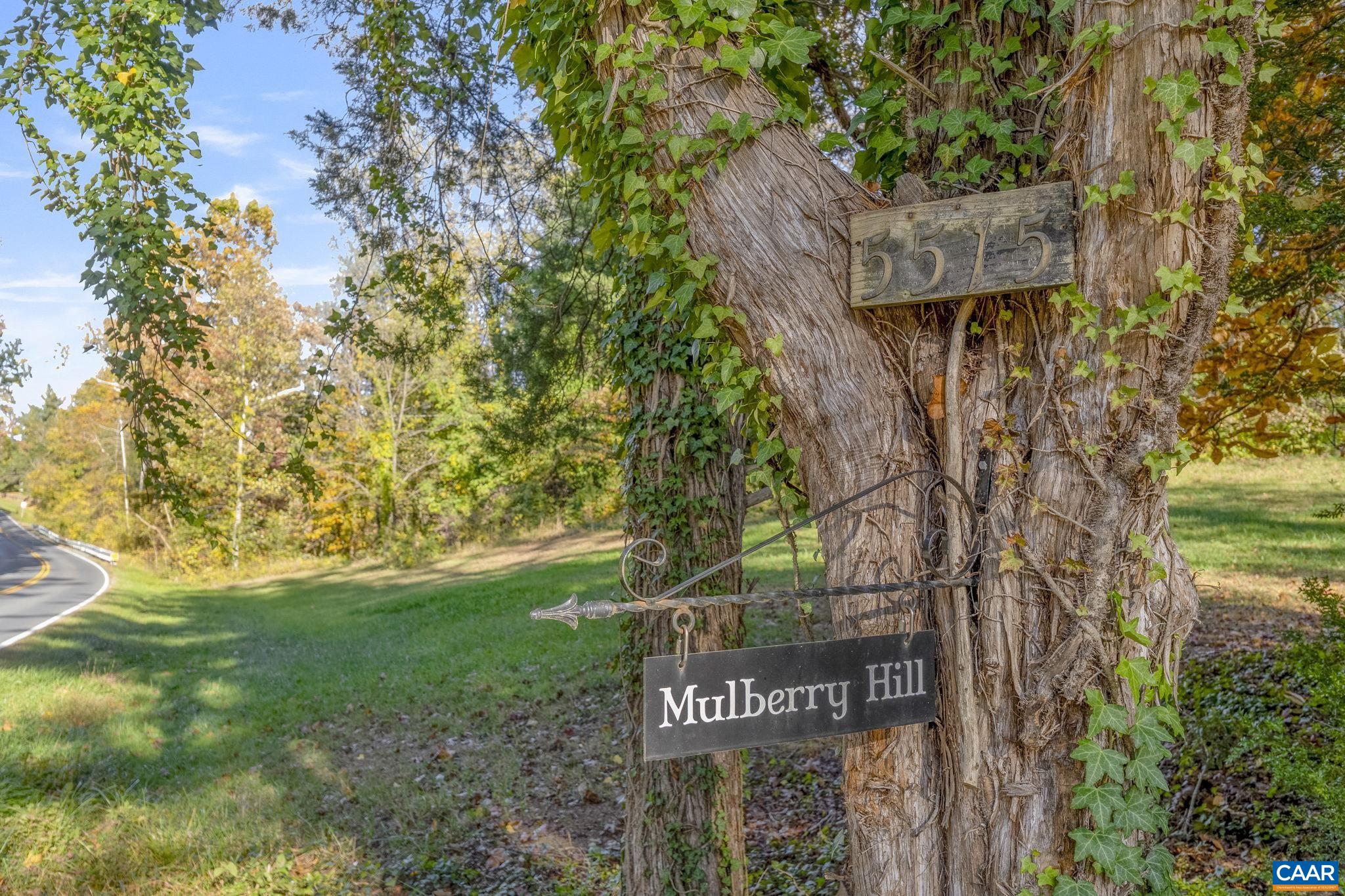 5515 L Gordonsville Road Keswick, VA 22947 - Photo 15 of 25 a view of a street sign under a large tree