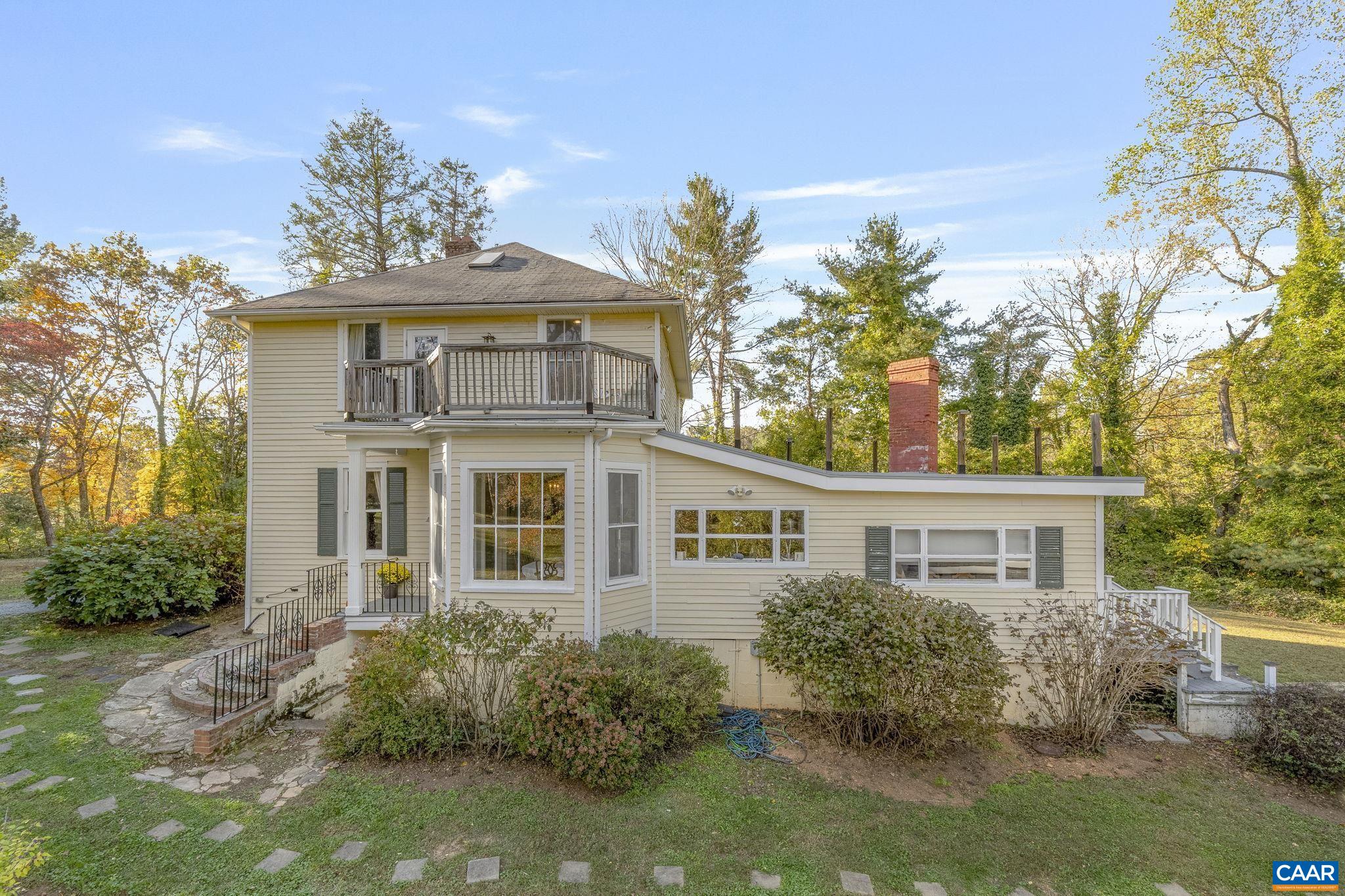 5515 L Gordonsville Road Keswick, VA 22947 - Photo 21 of 25 a view of a house with a garden