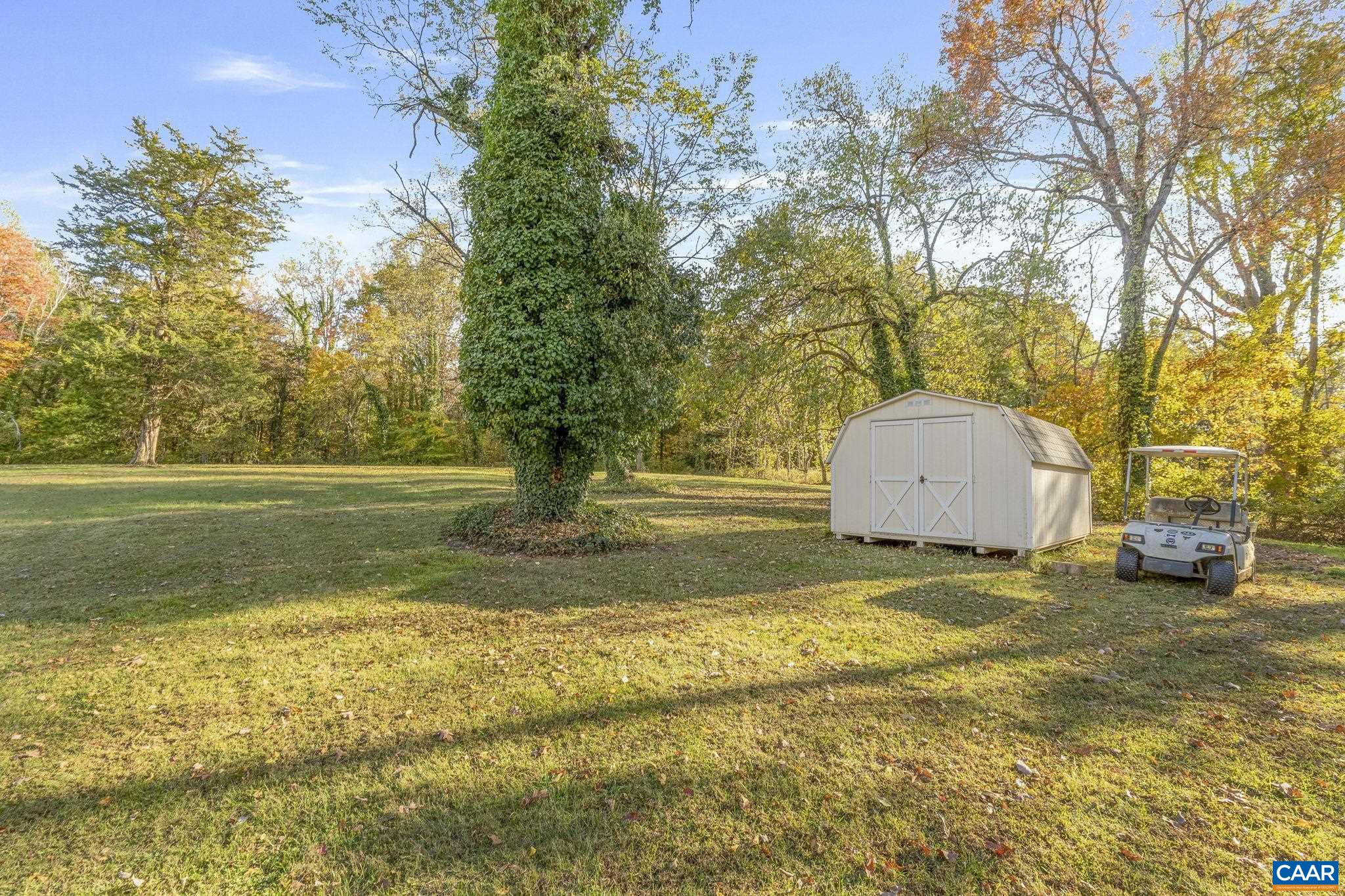 5515 L Gordonsville Road Keswick, VA 22947 - Photo 6 of 25 a view of a yard with swimming pool and green space