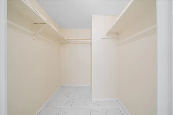 a view of an empty walk in closet