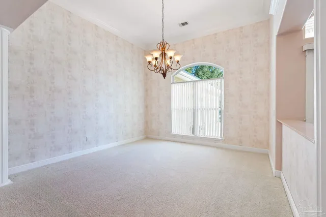 a kitchen with kitchen island a sink appliances and a counter top space
