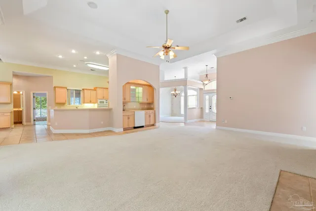 a large kitchen with a sink and cabinets