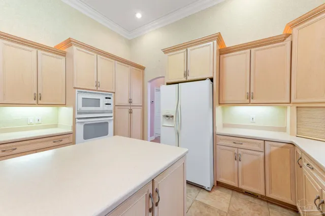 a bathroom with a double vanity sink mirror and bathtub