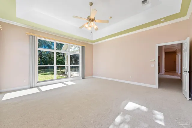 a spacious bathroom with a double vanity sink a mirror and shower