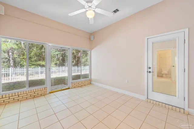 an aerial view of a house with yard and outdoor seating