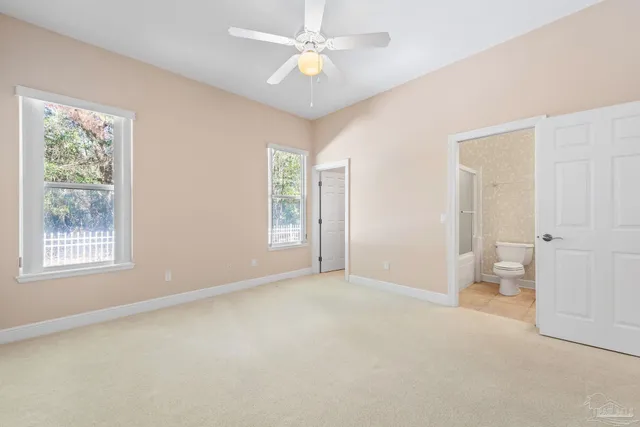an aerial view of a house with a yard swimming pool and outdoor seating