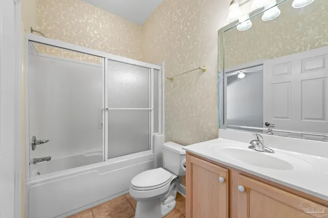 a view of a field with trees in the background