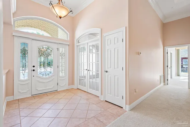 a living room with furniture a fireplace and a large window