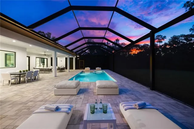 an aerial view of a house with swimming pool